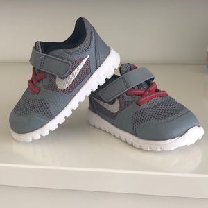 Kids grey & red Nike shoes